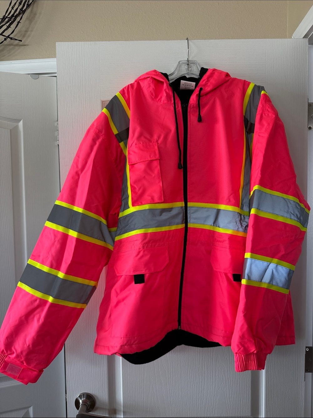 High-Visibility Neon Pink Utility Safety Jacket with Reflective Stripes